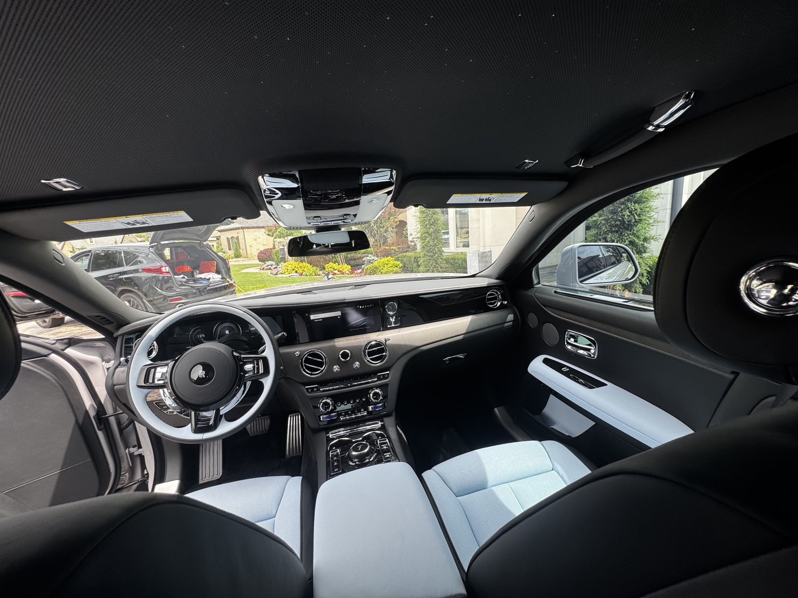 Rolls-Royce interior with light blue leather seats after a full interior detail
