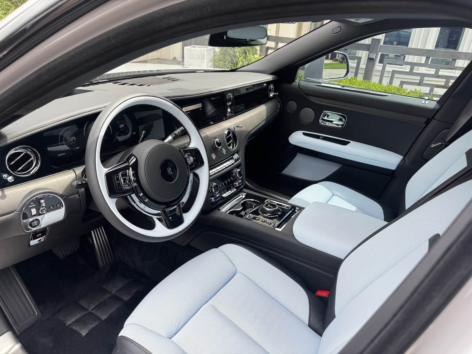 Rolls-Royce Ghost front cabin with pale blue leather after an interior detail