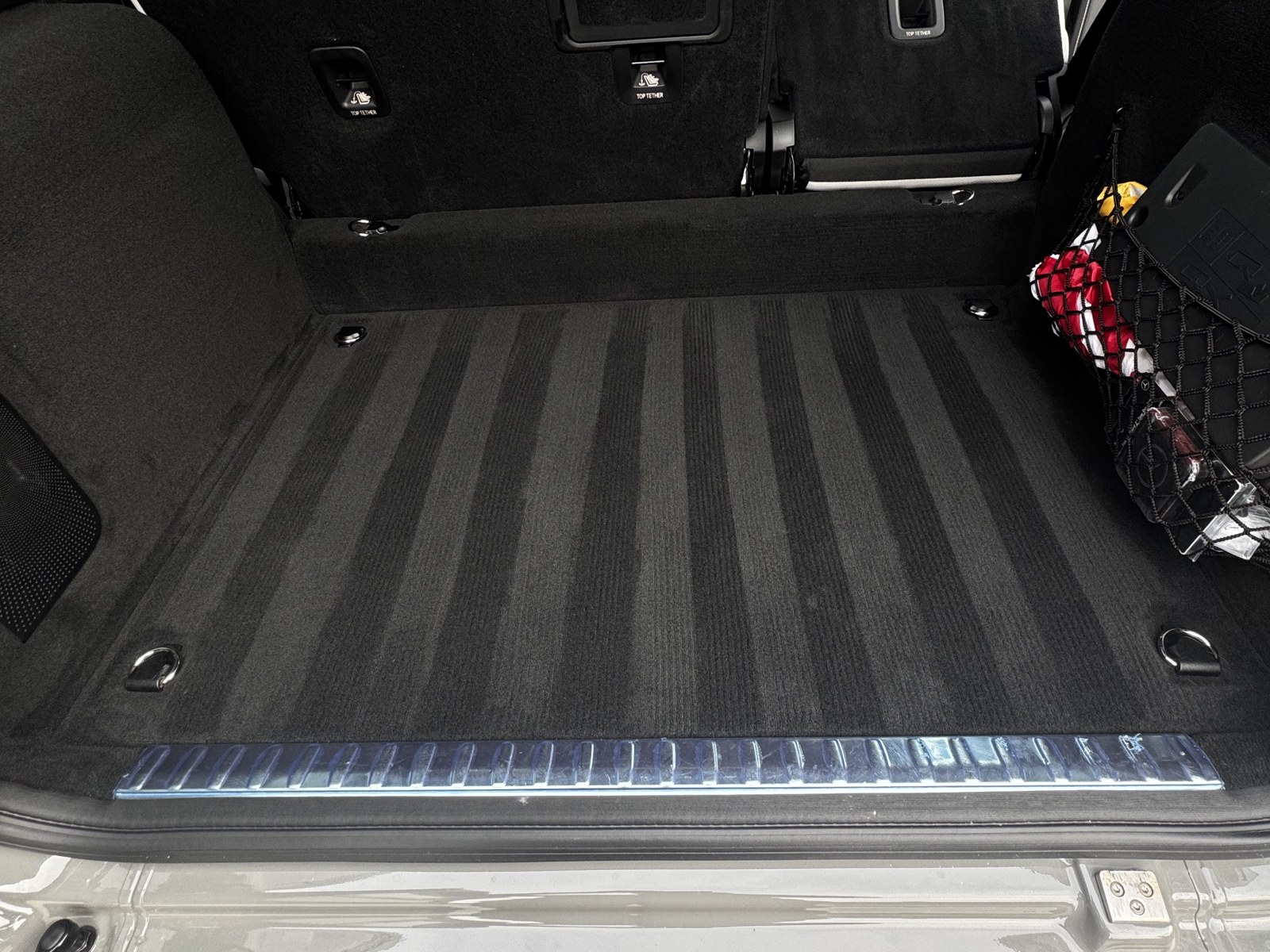 Vacuumed cargo area of an SUV with fresh carpet lines